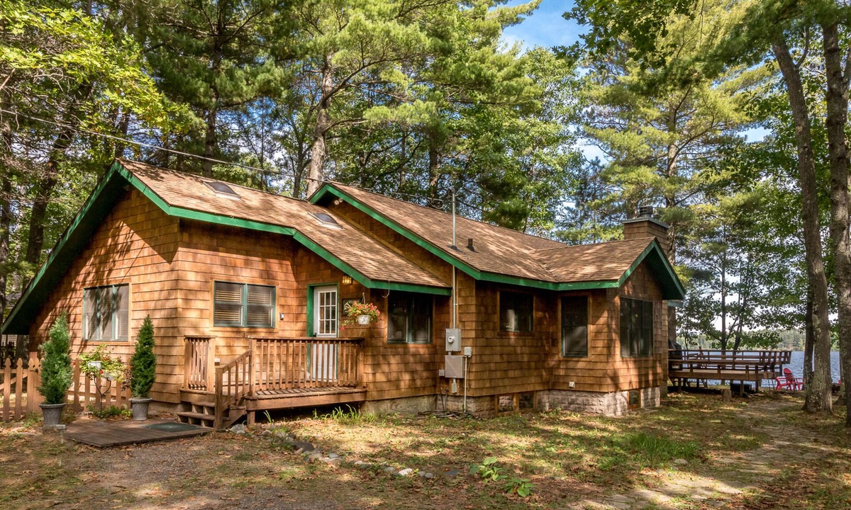 Manitowish Waters House | Lakefront home in a great location with docks, private beach, sauna & firepit