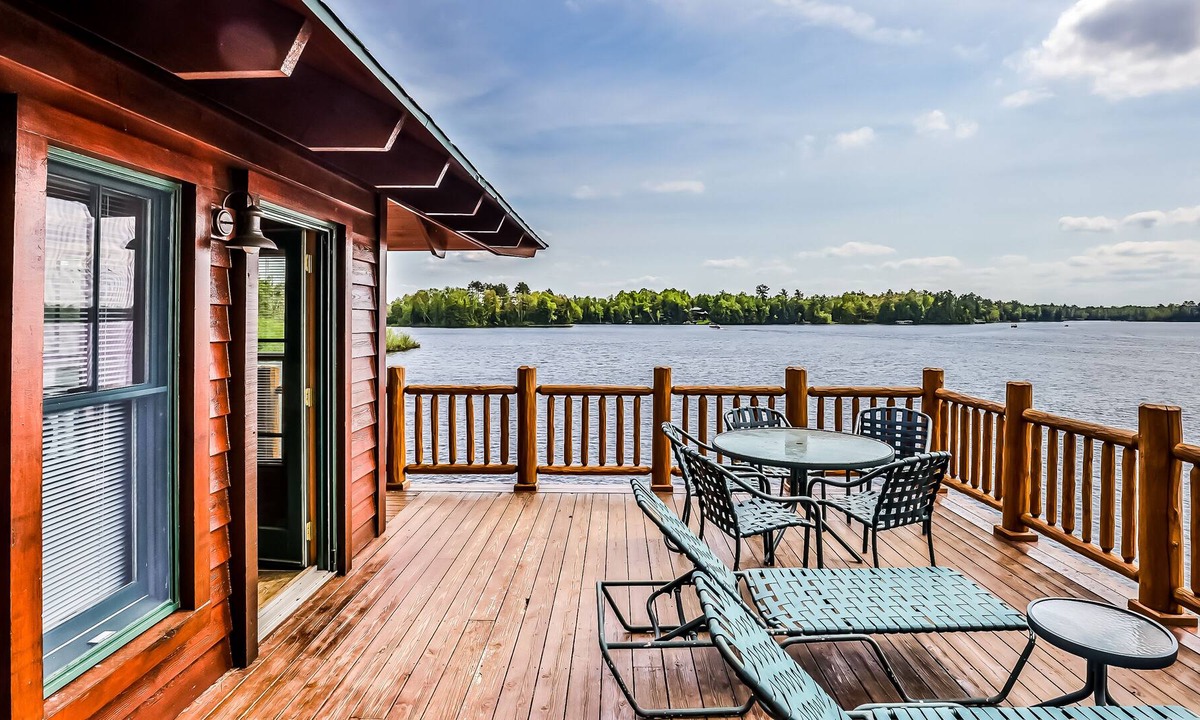 Manitowish Waters Condo | Lakefront home with large deck, gas grill, wood fireplace, heated pool, firepit