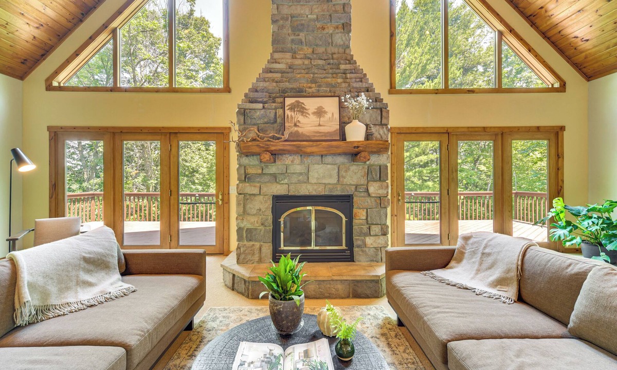 Amery House | New Listing! Timber Ridge Lake House is a private home in Amery Wisconsin on Lake Wapogasset/Bear Trap. The home balances the warmth of a large A-Frame with modern decor and finishes providing a serene stay with woods and lake views.