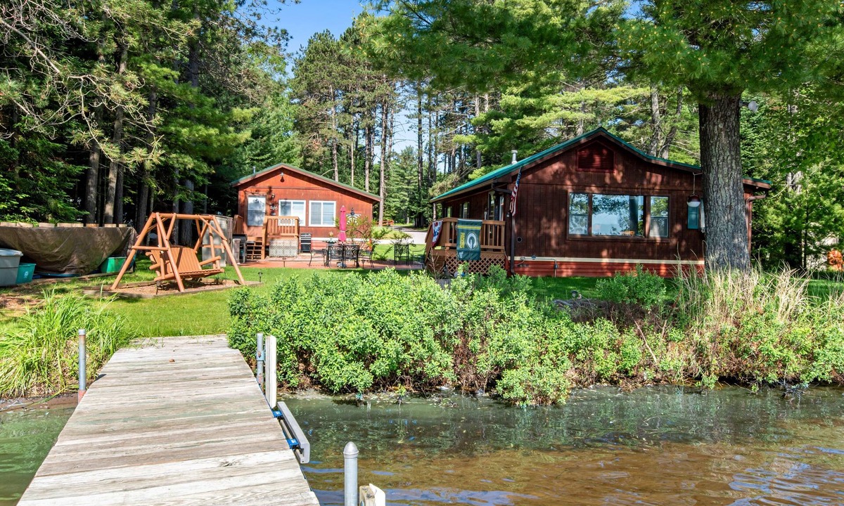 Eagle River House | Two cozy, lakefront cottages w/2 docks, a patio, firepit, 2 gas grills, & WIFI
