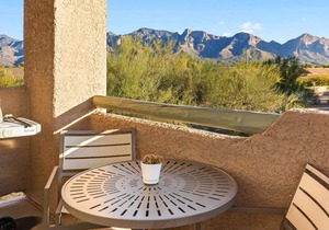 Enjoy the Oro Valley in this 1BD condo with resort amenities
