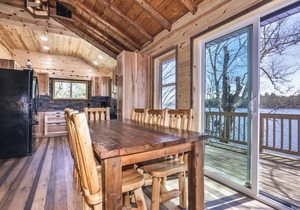 Remodeled lakeside resort cabin with fireplace, sandy beach, dock, firepit!
