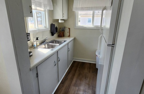 Gladstone Cottage | #7 2bed 1bath LAKE MI Fishing Cabin WiFi AC Deck Firepit Kayaks Paddle Boat Dock