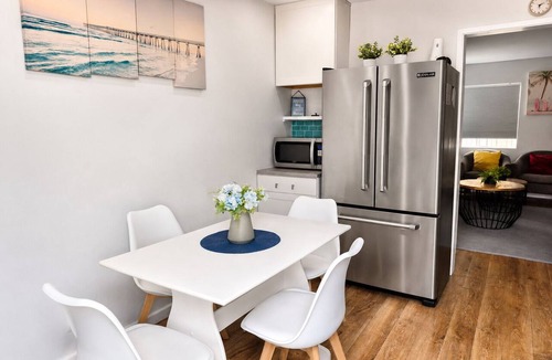 Pierpont Bay Apartment | Calypso Breeze, Hot Tub, Fire Pit, Games, 2 King Bed, 1 Minute Walk to the Beach