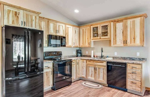 Conover House | Charming dog-friendly cabin with hot tub, fireplace, patio, grill, & central AC