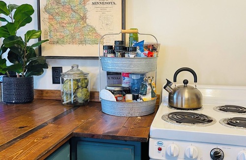 Brainerd Cabin | Charming 1BR riverside cabin in Brainerd, MN. River sunsets, stocked kitchenette, fire pit, 10 min to downtown. Ideal for couples, small families & remote workers seeking a peaceful Up North escape.