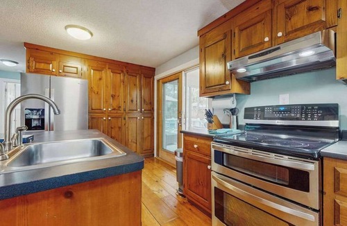 Brewster House | Cheery house with deck, sunroom & patio - short walk to pond, beach & Rail Trail