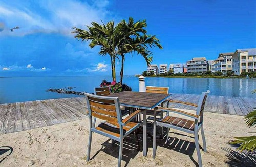 Sunset Island House | Coastal retreat with beach and shared pool - balconies, AC, & W/D