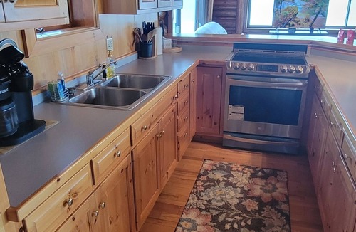 Arbor Vitae Cabin | Cozy boat house on the lake! Private dock and beautiful water views!