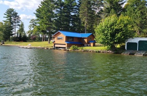 Arbor Vitae Cabin | Cozy boat house on the lake! Private dock and beautiful water views!