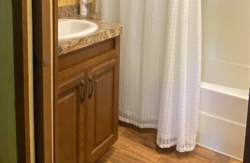 Pelican Rapids Cabin | Cozy cabin on a private wooded lot.