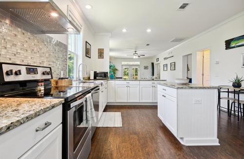 Henderson Point House | Cozy cottage surrounded by woods and just a short walk to the beach!