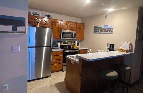 Sister Bay Condo | Cozy Sister Bay Waterfront! Ground level porch, lawn, pier, bay, garage parking