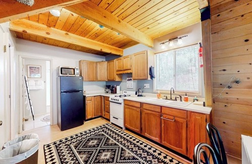 Crestline House | Dog-friendly 2-story home with large deck, tree views, fireplace, & W/D