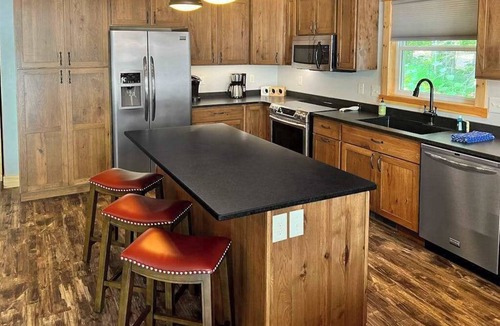 Minocqua House | Dog-friendly lakefront hideaway with docks, firepit, fireplace & W/D