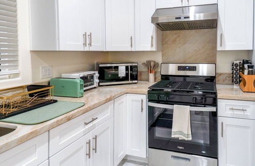 Riverview West House | Elegant Modern Disney Villa King Beds Game Room + EV Charger Sleeps 14