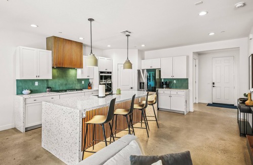 Coachella House | Escape to this newly remodeled 7-bedroom desert retreat designed for relaxation and fun. Enjoy a large resort-style pool and spa, a fully stocked kitchen, spacious game room, and outdoor games perfect for group play under endless blue skies. Whether