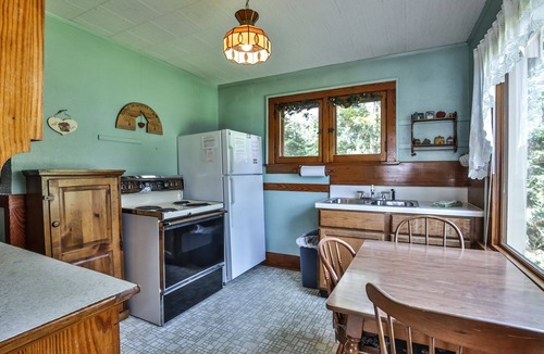 St Germain House | Gorgeous lakefront cabin, wrap-around enclosed porch, dock!