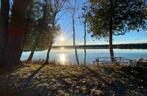 Baileys Harbor Cottage | Lakefront Cottage Retreat w/Private Dock, Paddle Boards, Fire Pit, Sunset Views