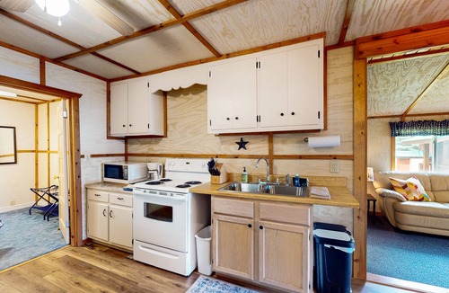 Eagle River House | Lakefront cottage w/a dock, shared furnished patio, firepit, & a paddleboat