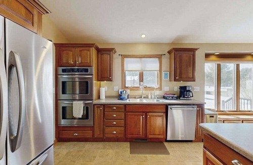 Friendship House | Lakefront home with grill, firepit, pool table, & jetted tub
