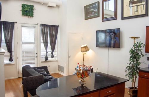 Uptown Condo | Lakeside Haven Minneapolis Loft with BBQ Area, Patio, Central AC, Games, W & D