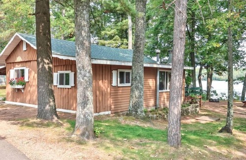 St Germain Cabin | Lakeside resort cabin right on Little Saint with dock, sandy beach, firepit!