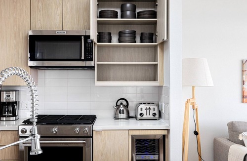 Carthay Circle Apartment | Luxe Fairfax 2BR w/ W/D, Pool, Private Patio, near WF + TJ, by Blueground