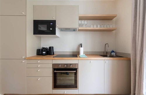 Saint-Vincent-de-Paul Apartment | Luxe, State of the Art Suite near Montmartre
