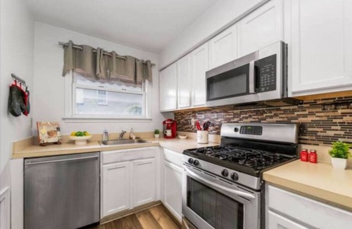 Little Italy House | Make unforgettable memories in this spacious 5-bedroom, 2-bathroom home in Baltimore’s downtown district. Just steps from Little Italy, this Airbnb offers free parking, modern amenities, and plenty of space for families or large groups to relax.