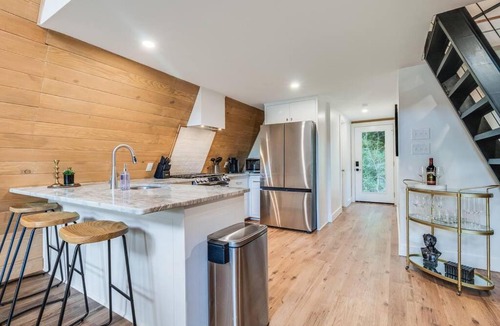 New Iberia Apartment | Modern A-Frame Cabin by Rip Van Winkle with Hot Tub