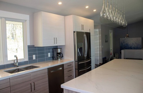 Aitkin House | Modern retreat on Cedar Lake- quiet wooded lot with beautiful lake view!