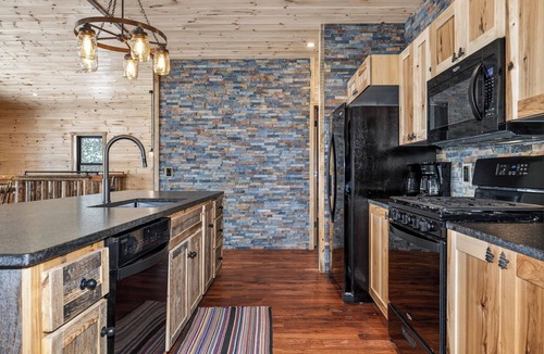 St Germain House | NEW BUILD! Lakefront resort cabin with fireplace, sandy beach, dock, fire pit!