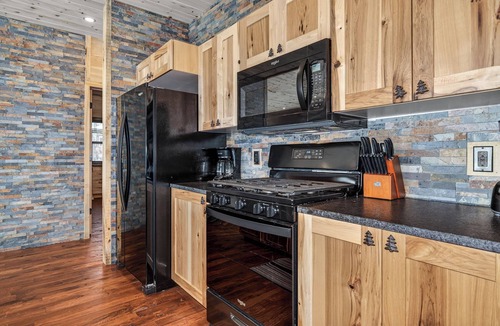 St Germain House | NEW BUILD! Lakefront resort cabin with fireplace, sandy beach, dock, fire pit!