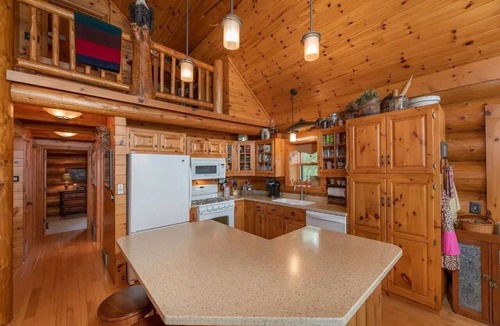 Land O Lakes Cabin | Otter Point Lodge - 4BR, 3BA 1100ft water frontage log home w/2 docks & firepit
