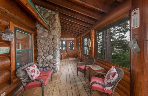 Land O Lakes Cabin | Otter Point Lodge - 4BR, 3BA 1100ft water frontage log home w/2 docks & firepit