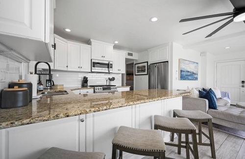 Balboa Peninsula Apartment | Patio on the Boardwalk steps to the Ocean