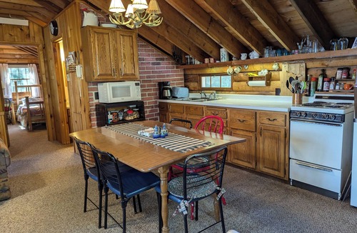 Outing Cabin | Private, cozy 4-bedroom log cabin with 374 feet of lakeshore on Washburn Lake!