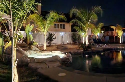 Temecula House | Private master Bedroom with tropical garden and pool view