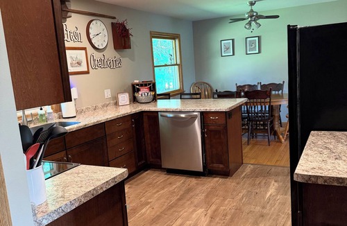 Babcock House | Relax by the river in this 4 bedroom house with firepit- spot our river eagle!