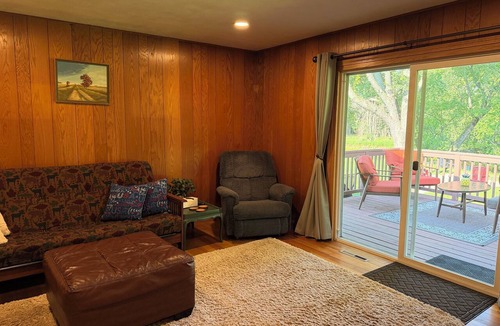 Babcock House | Relax by the river in this 4 bedroom house with firepit- spot our river eagle!