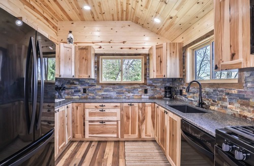 St Germain House | Remodeled lakeside resort cabin with fireplace, sandy beach, dock, firepit!
