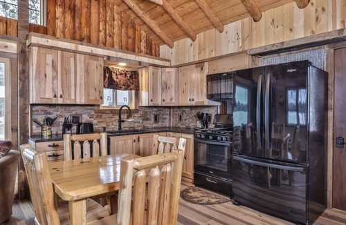 St Germain House | Remodeled lakeside resort cabin with fireplace, sandy beach, dock, firepit!
