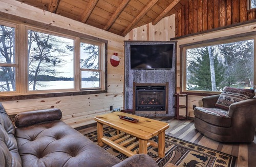 St Germain House | Remodeled lakeside resort cabin with fireplace, sandy beach, dock, firepit!