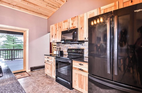 St Germain House | Remodeled lakeside resort lodge with fireplace, sandy beach, dock, firepit!