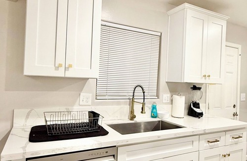 Baker Street House | Spacious 4-bedroom house in charming Bakersfield with AC. 4 queen & 3 twin beds.