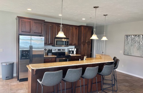 Arnolds Park Condo | Spacious & Luxurious Lakefront Bridge Bay Corner Condo. 6 daily waterpark passes