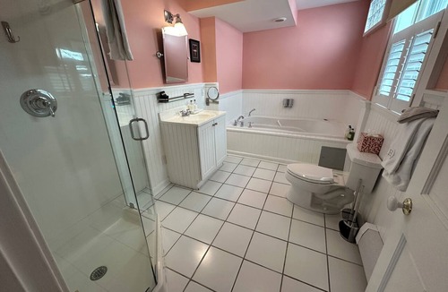 Newport Hotel | Step back in time with modern comfort in this charming exposed beam, private suite in Historic downtown Newport RI! King bed + pull-out sofa, ensuite bath, gas fireplace, AC, TV, mini fridge, coffee station. Steps to Thames Street, shops, wharfs