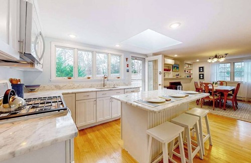 East Orleans House | Tranquil & sunlit home with peaceful yard, large deck, & fireplace - near beach