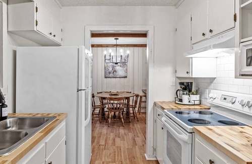 Uncertain Cabin | Unwind in a cozy rustic-modern cabin with a front porch, private dock access, firepit nights, outdoor dining, and cornhole. RV site next to house.